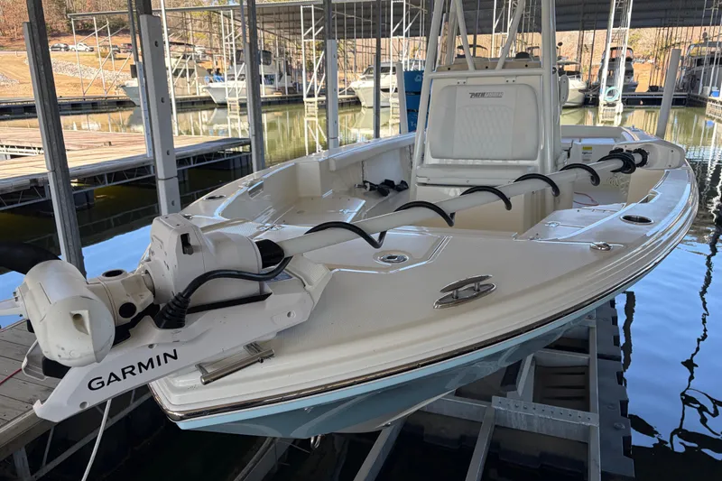 Slide: The Image of 2025 Pathfinder 2400 TRS boat docked, featuring Garmin equipment, in a marina setting. - 3