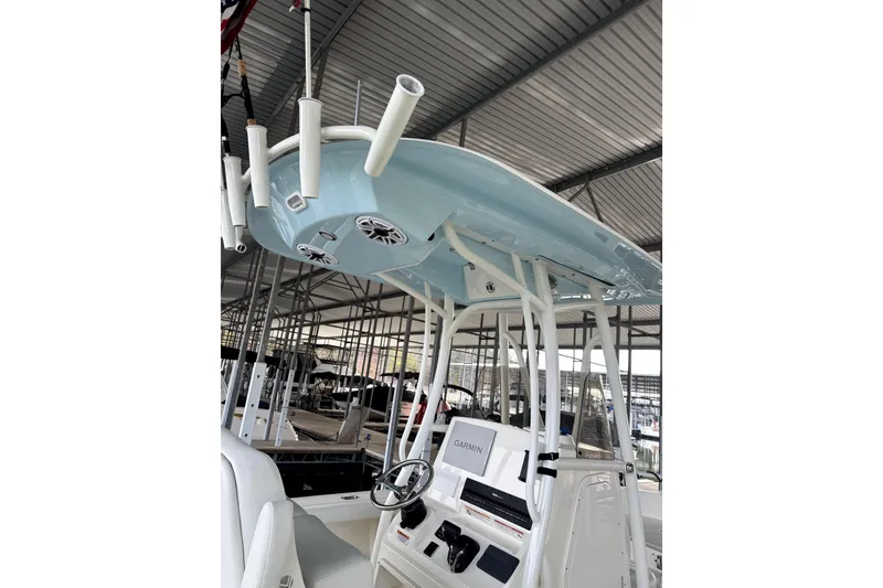 Slide: The Image of 2025 Pathfinder 2400 TRS boat with T-top and Garmin navigation system in marina. - 4