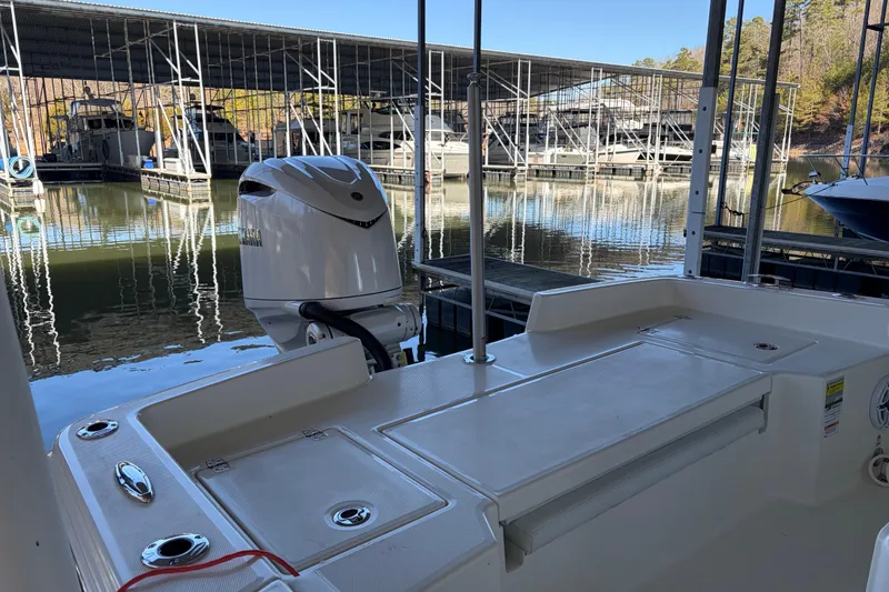 Slide: The Image of 2025 Pathfinder 2400 TRS boat docked at marina with Yamaha outboard motor. - 5