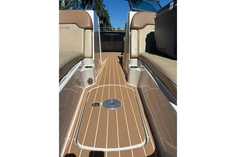 Slide: The Image of 2007 Sea Ray 260 Sundeck boat on calm water with canopy and seating. - 3