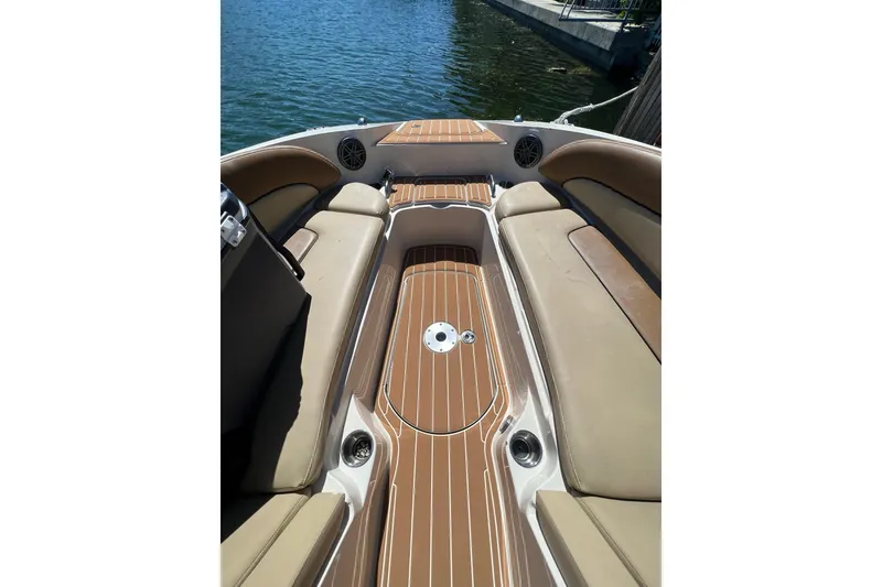 Slide: The Image of 2007 Sea Ray 260 Sundeck boat on water, rear view with seating and deck. - 4