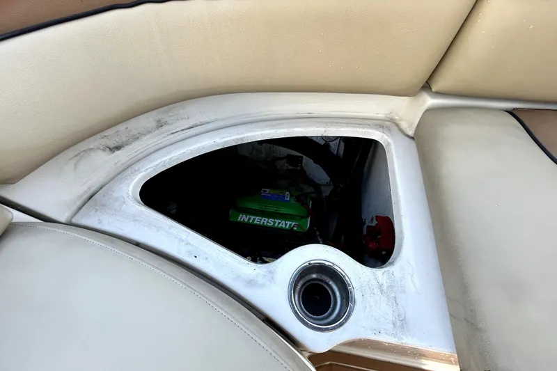 Slide: The Image of 2007 Sea Ray 260 Sundeck storage compartment with visible battery. - 45