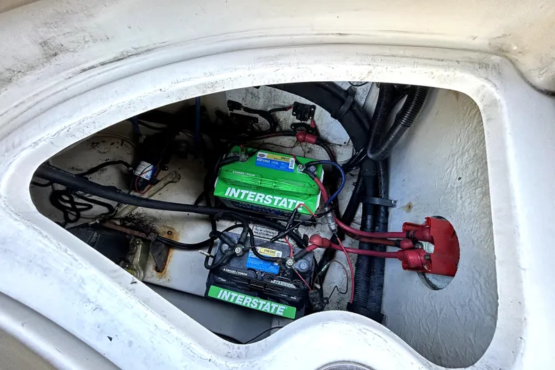 Slide: The Image of Battery compartment of a 2007 Sea Ray 260 Sundeck boat, featuring Interstate batteries. - 46
