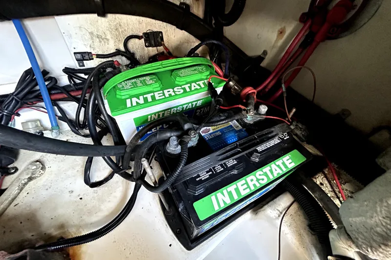 Slide: The Image of Batteries in a 2007 Sea Ray 260 Sundeck boat engine compartment. - 47
