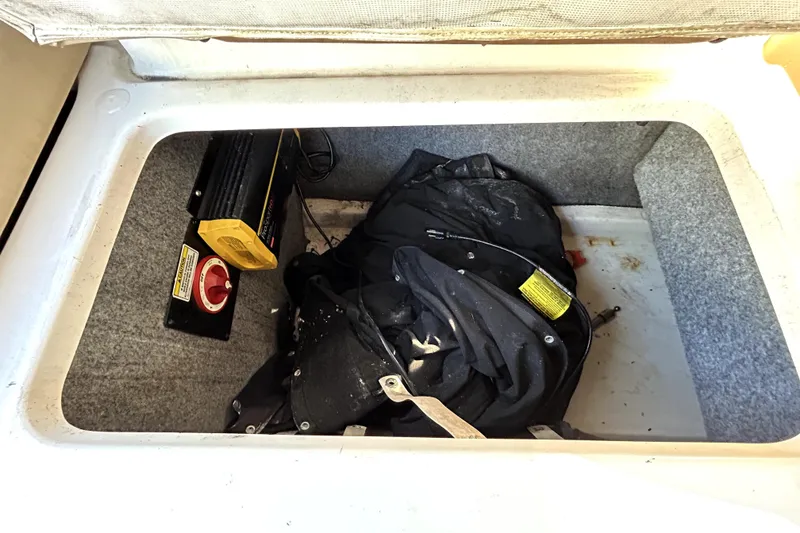 Slide: The Image of Storage compartment of a 2007 Sea Ray 260 Sundeck with equipment and cables. - 50