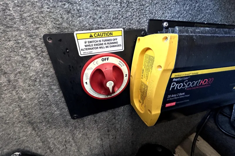 Slide: The Image of Battery switch and charger in 2007 Sea Ray 260 Sundeck boat. - 51