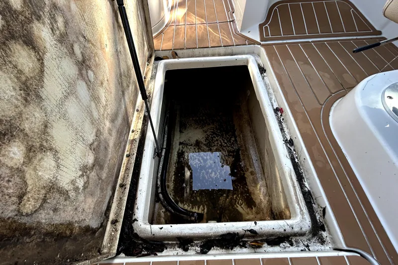 Slide: The Image of Open storage compartment on 2007 Sea Ray 260 Sundeck boat, showing interior condition. - 53