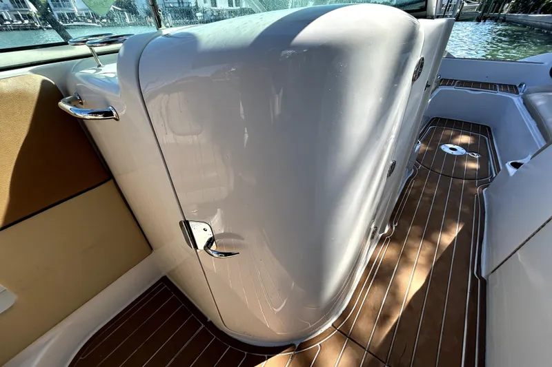Slide: The Image of 2007 Sea Ray 260 Sundeck interior with sleek design and wood-patterned flooring. - 55