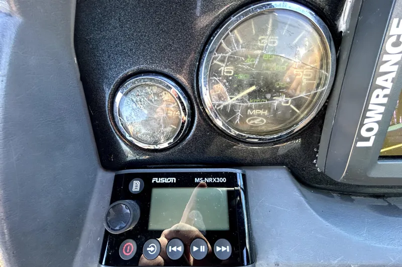 Slide: The Image of Dashboard of a 2007 Sea Ray 260 Sundeck with gauges and Fusion MS-NRX300. - 63