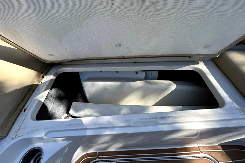Slide: The Image of Open storage compartment on a 2007 Sea Ray 260 Sundeck boat. - 86