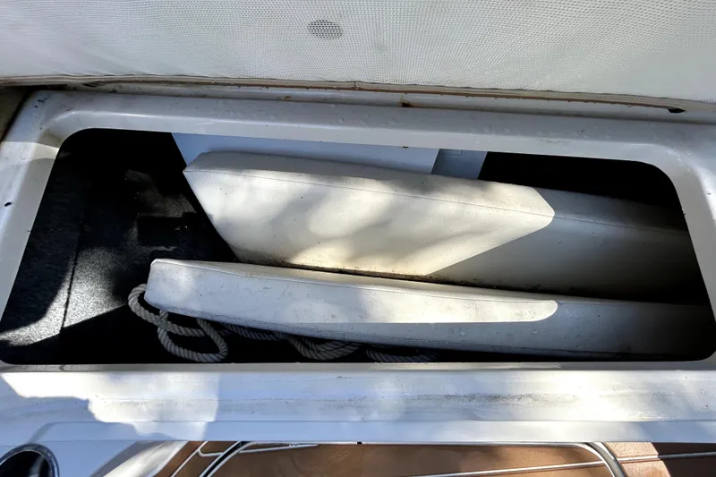 Slide: The Image of Storage compartment of 2007 Sea Ray 260 Sundeck with ropes and equipment. - 87