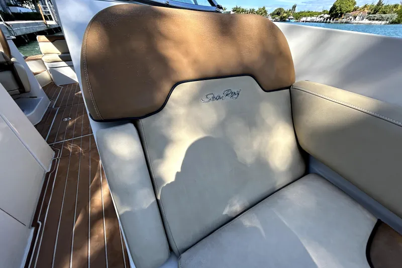 Slide: The Image of 2007 Sea Ray 260 Sundeck interior with tan and cream seating, wood-patterned flooring. - 88