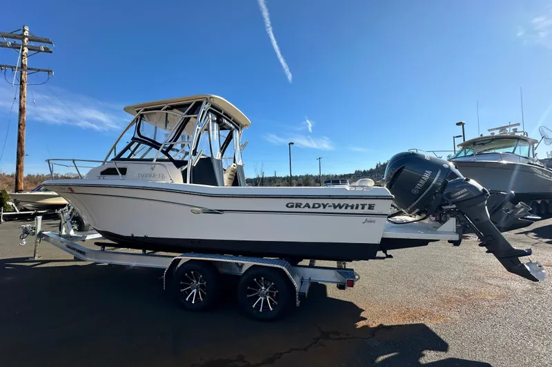 The Image of 2016 Grady-White Seafarer 228 boat on trailer, sunny day, Yamaha outboard motor. - 0