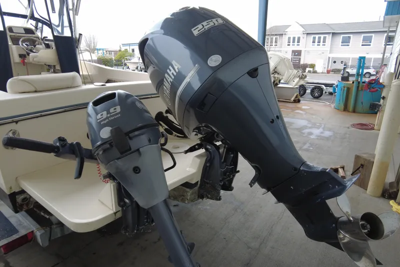 Slide: The Image of 2016 Grady-White Seafarer 228 with Yamaha outboard motors at a marina. - 3