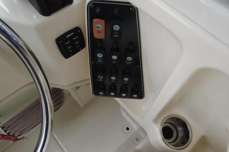 Slide: The Image of Control panel of a 2016 Grady-White Seafarer 228 boat cockpit. - 6