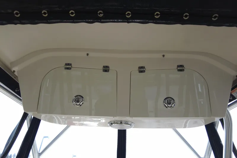 Slide: The Image of 2016 Grady-White Seafarer 228 boat storage compartment with secure latches and sleek design. - 8