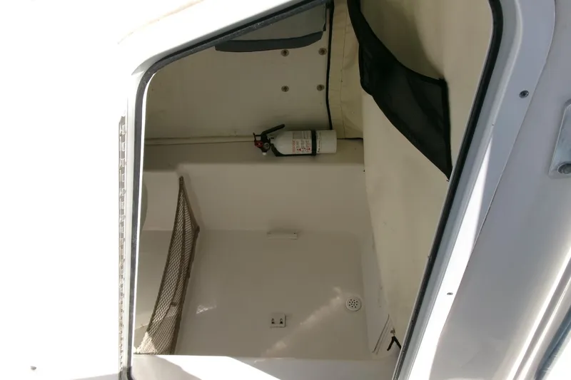 Slide: The Image of Storage compartment of 2016 Sea Fox 186 Commander boat with fire extinguisher. - 11