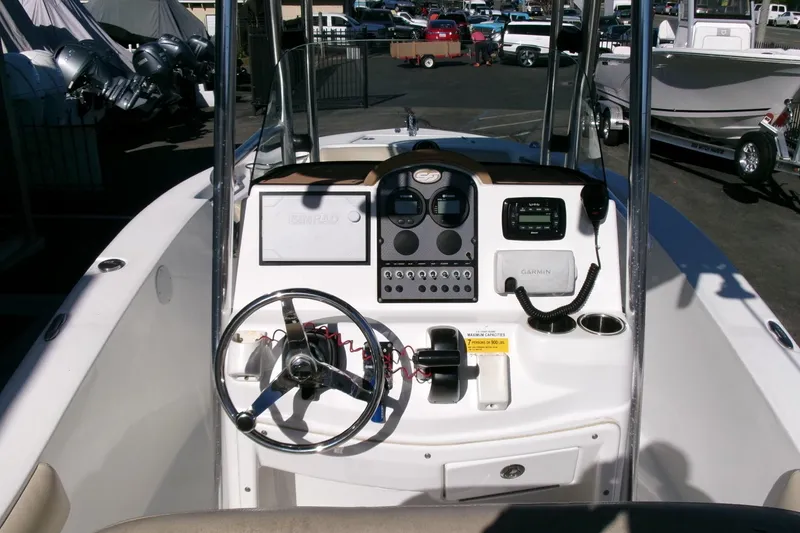 Slide: The Image of 2016 Sea Fox 186 Commander boat dashboard with steering wheel and navigation controls. - 12