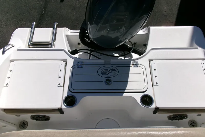 Slide: The Image of 2016 Sea Fox 186 Commander boat deck with storage compartments and motor. - 17