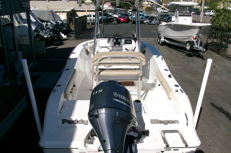 Slide: The Image of 2016 Sea Fox 186 Commander boat with Yamaha 115 engine, parked in a dealership lot. - 21