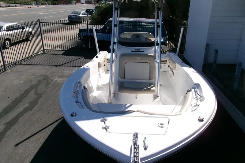 Slide: The Image of 2016 Sea Fox 186 Commander boat parked on pavement near a fence. - 22