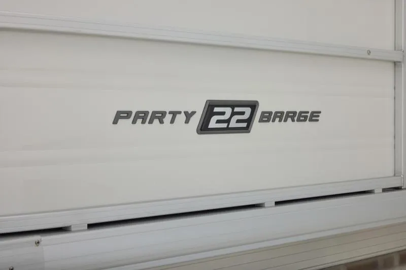Slide: The Image of 2026 Sun Tracker Party Barge 22 DLX logo on white background. - 18