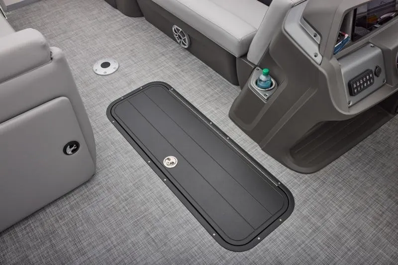 Slide: The Image of 2026 Sun Tracker Party Barge 22 DLX interior with gray flooring and seating. - 26