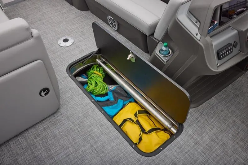 Slide: The Image of Storage compartment on 2026 Sun Tracker Party Barge 22 DLX with gear and accessories. - 28