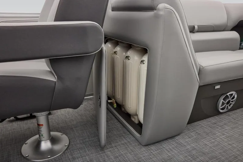 Slide: The Image of 2026 Sun Tracker Party Barge 22 DLX interior with storage compartment and seating. - 29