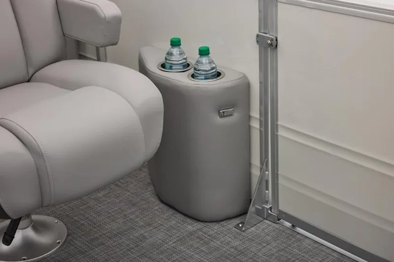 Slide: The Image of 2026 Sun Tracker Party Barge 22 DLX interior with cup holders and seating. - 40