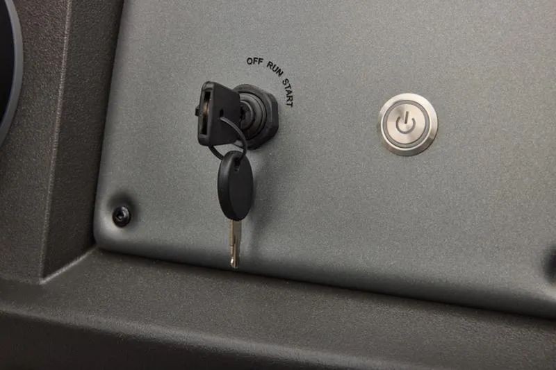 Slide: The Image of Ignition switch and power button on 2026 Sun Tracker Party Barge 22 DLX dashboard. - 41