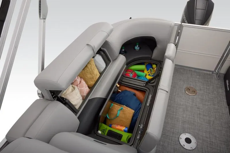 Slide: The Image of 2026 Sun Tracker Party Barge 22 DLX interior storage with various items. - 49