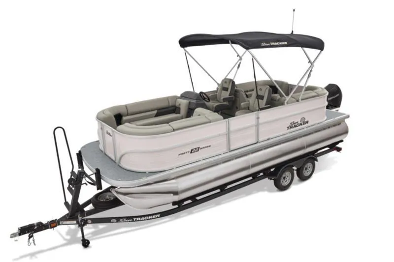 Slide: The Image of 2026 Sun Tracker Party Barge 22 DLX pontoon boat on trailer, featuring spacious seating and canopy. - 8