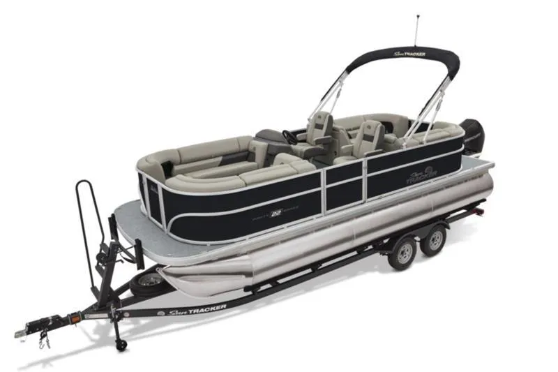 Slide: The Image of 2026 Sun Tracker Party Barge 22 DLX pontoon boat on trailer, featuring spacious seating. - 9