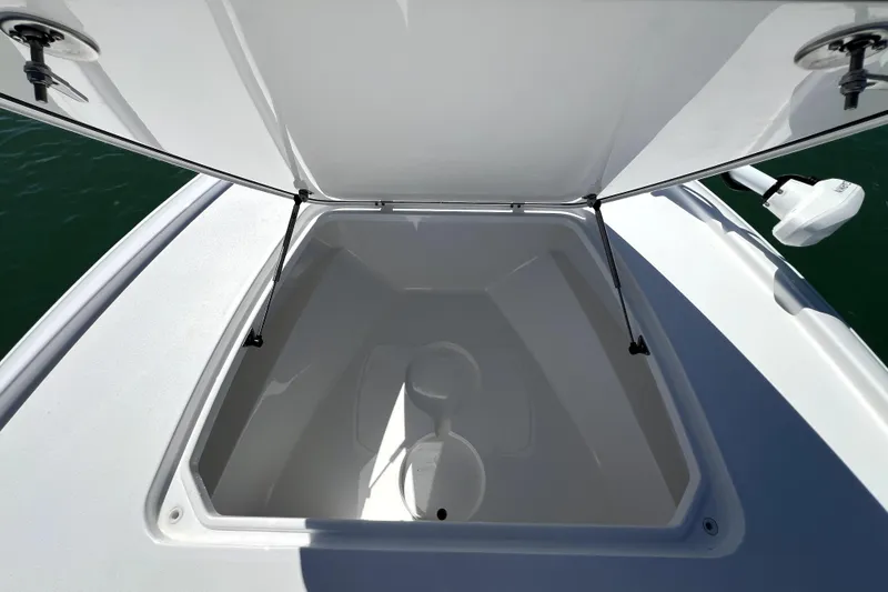 Slide: The Image of Open storage compartment on 2026 Contender 26 Bay boat, showcasing spacious interior design. - 14