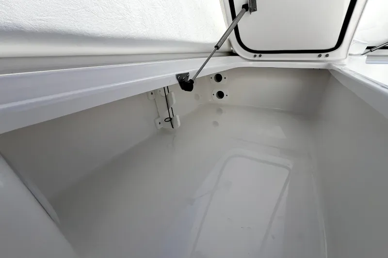 Slide: The Image of Open storage compartment in 2026 Contender 26 Bay boat, showcasing interior space and design. - 15