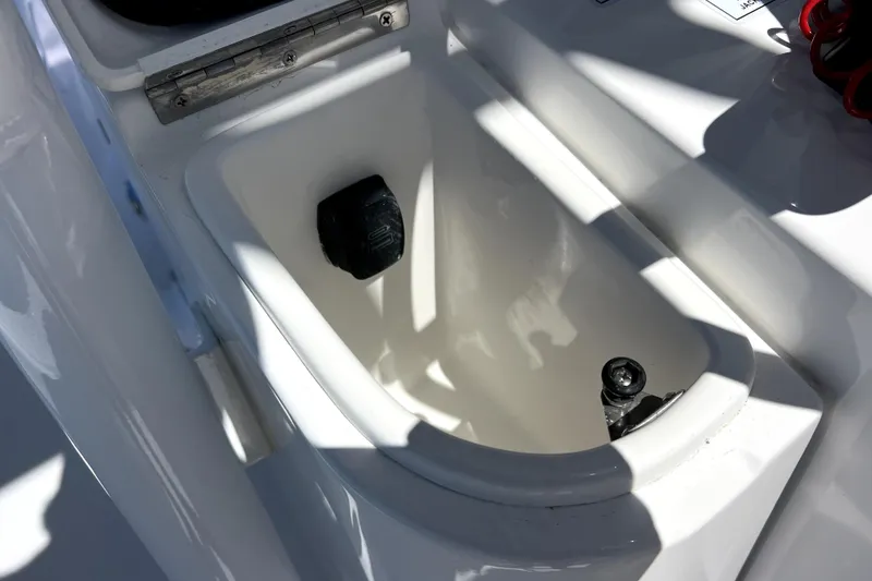 Slide: The Image of Contender 26 Bay 2026 boat interior detail with storage compartment and fittings. - 24