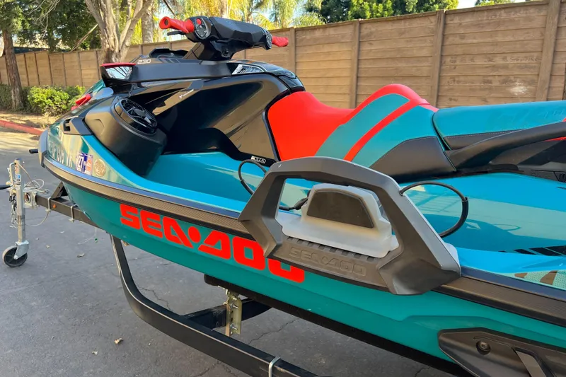 Slide: The Image of 2018 Sea-Doo Wake Pro 230 jet ski on trailer, vibrant blue and red design. - 4