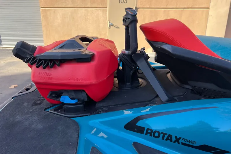 Slide: The Image of 2018 Sea-Doo Wake Pro 230 with red fuel canister and Rotax power branding. - 7