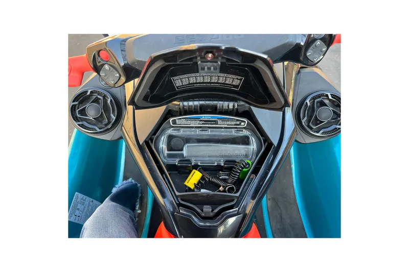 Slide: The Image of 2018 Sea-Doo Wake Pro 230 dashboard with storage compartment open, showing controls and accessories. - 8