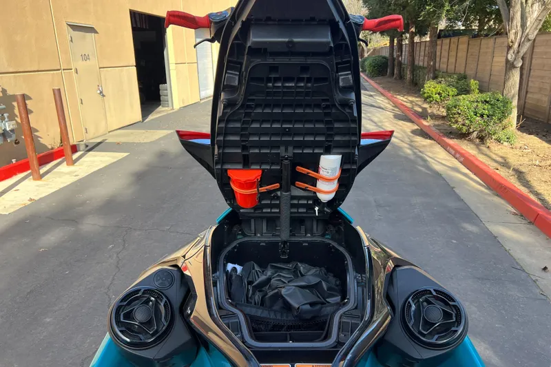 Slide: The Image of 2018 Sea-Doo Wake Pro 230 with open storage compartment, showing interior details. - 9