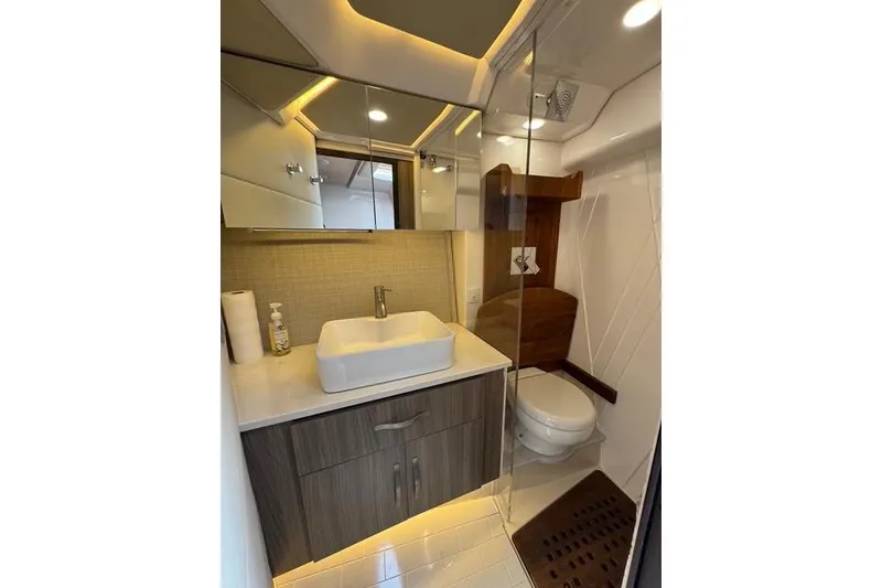 Slide: The Image of Luxurious bathroom in 2021 Regal 36 Grande Coupe yacht with modern fixtures and elegant design. - 12