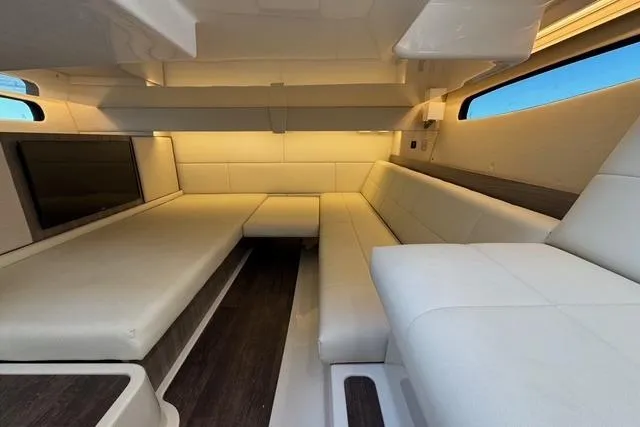 Slide: The Image of Luxurious interior of 2021 Regal 36 Grande Coupe yacht with elegant seating. - 14