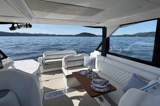 Slide: The Image of Luxurious interior of 2021 Regal 36 Grande Coupe yacht with scenic ocean view. - 5