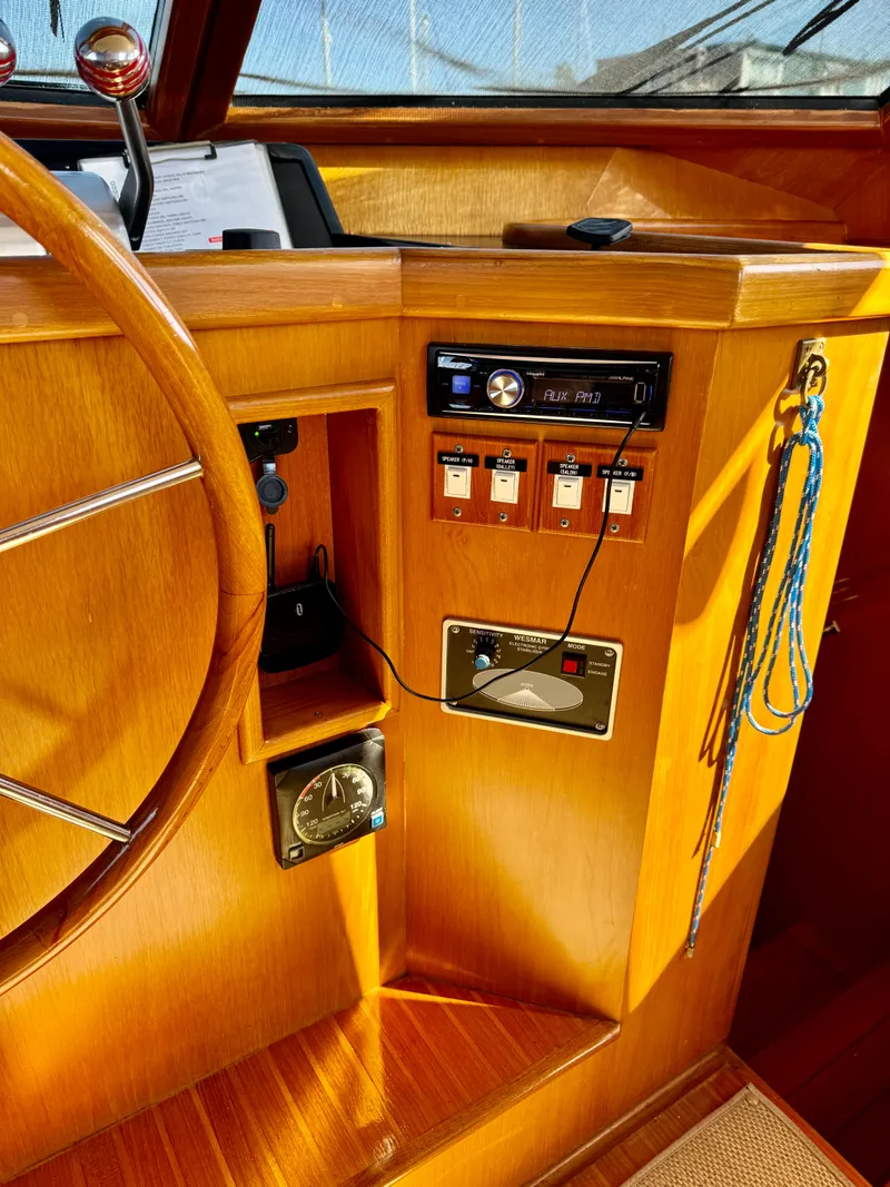 Slide: The Image of Interior of 1997 McKinna 48 Pilothouse with wooden helm and control panel. - 20