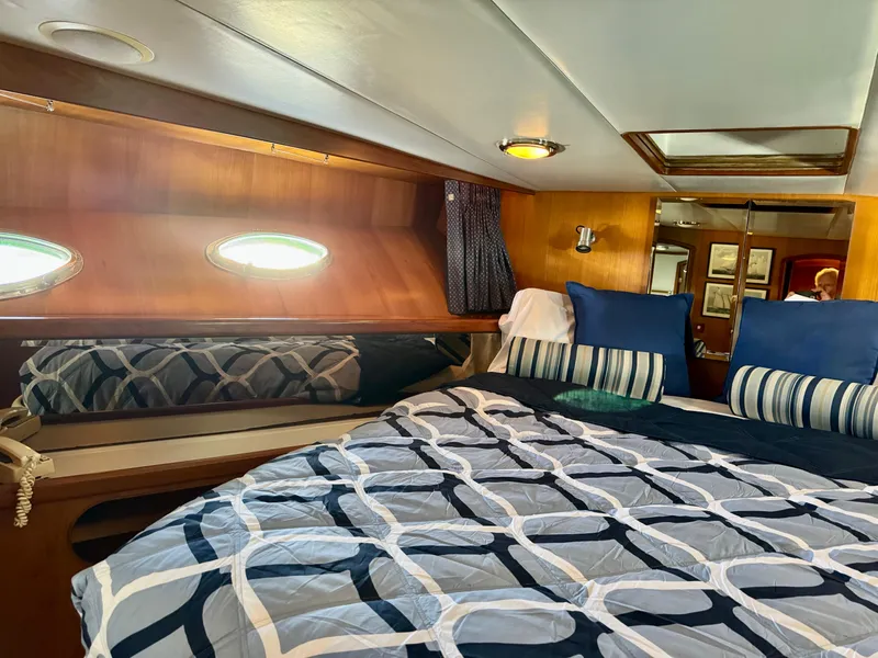 Slide: The Image of Luxurious cabin interior of 1997 McKinna 48 Pilothouse yacht with stylish bedding. - 23