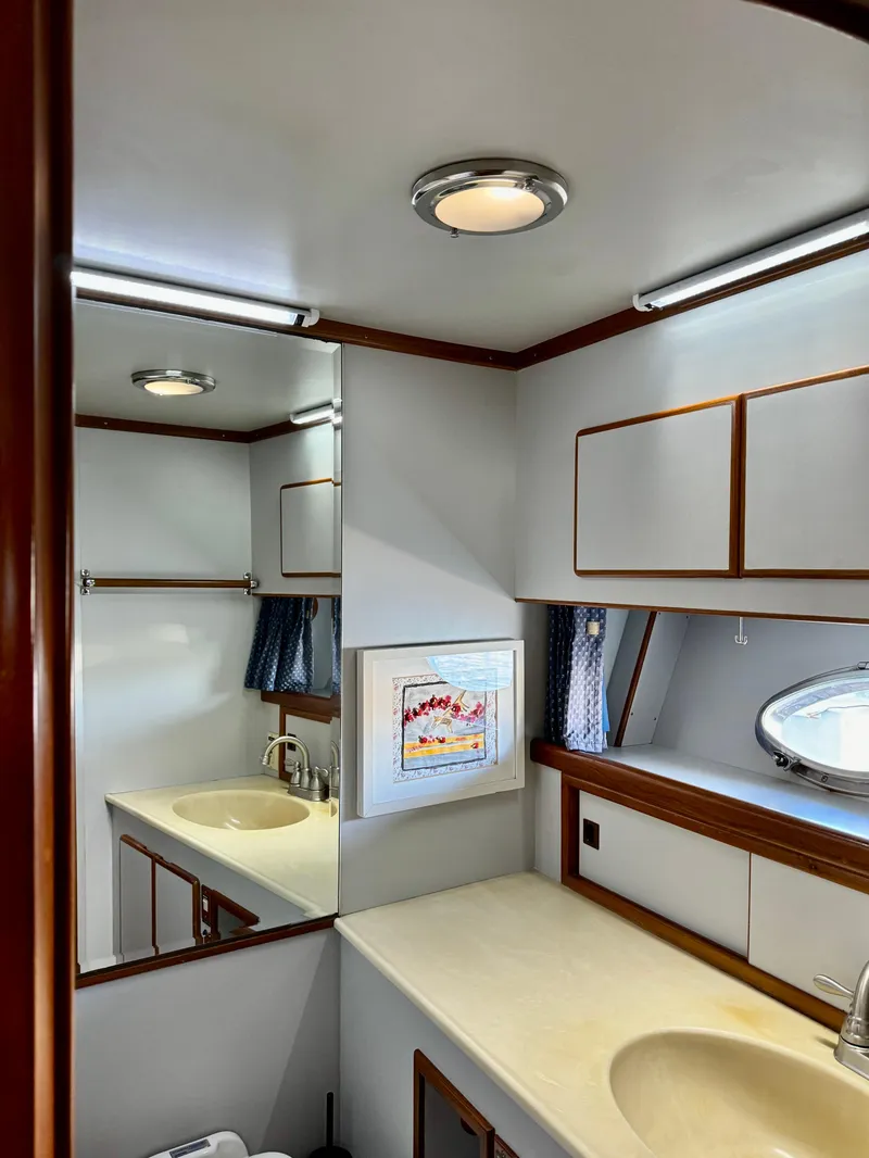 Slide: The Image of Bathroom interior of 1997 McKinna 48 Pilothouse yacht with sink and mirror. - 28