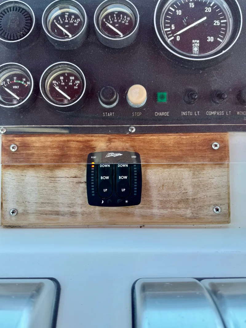 Slide: The Image of 1997 McKinna 48 Pilothouse dashboard with gauges and control panel. - 32