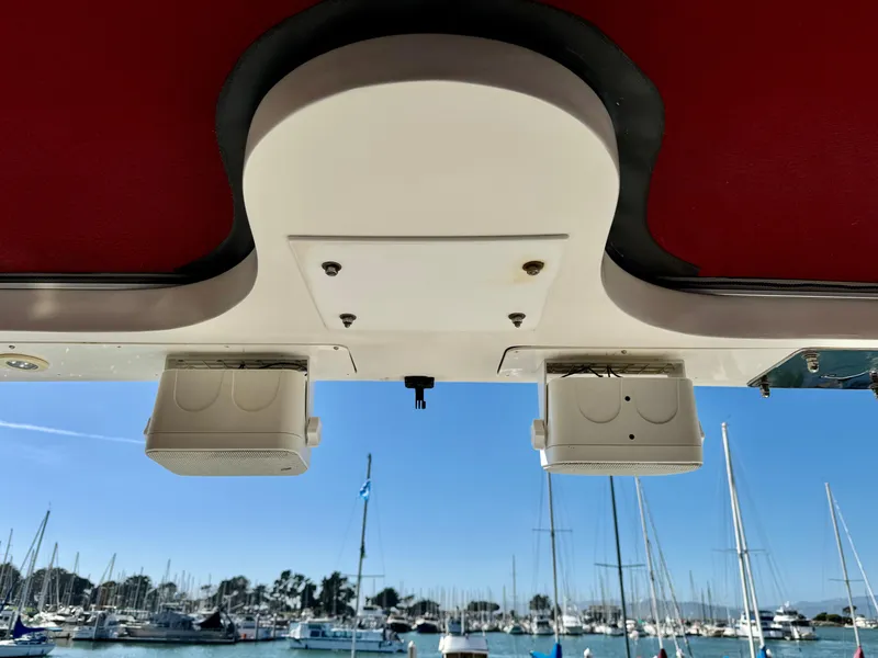 Slide: The Image of 1997 McKinna 48 Pilothouse speakers with marina view in background. - 35