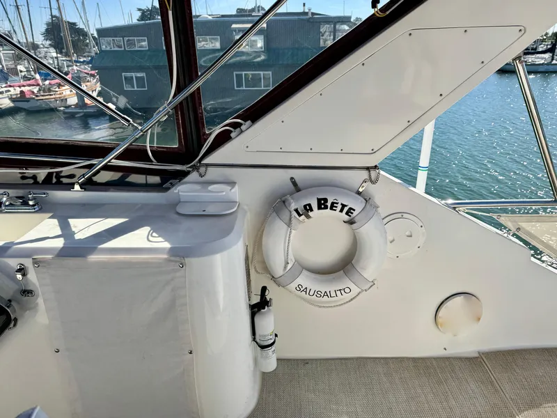 Slide: The Image of 1997 McKinna 48 Pilothouse interior with life preserver labeled "La Bête," docked in Sausalito. - 36